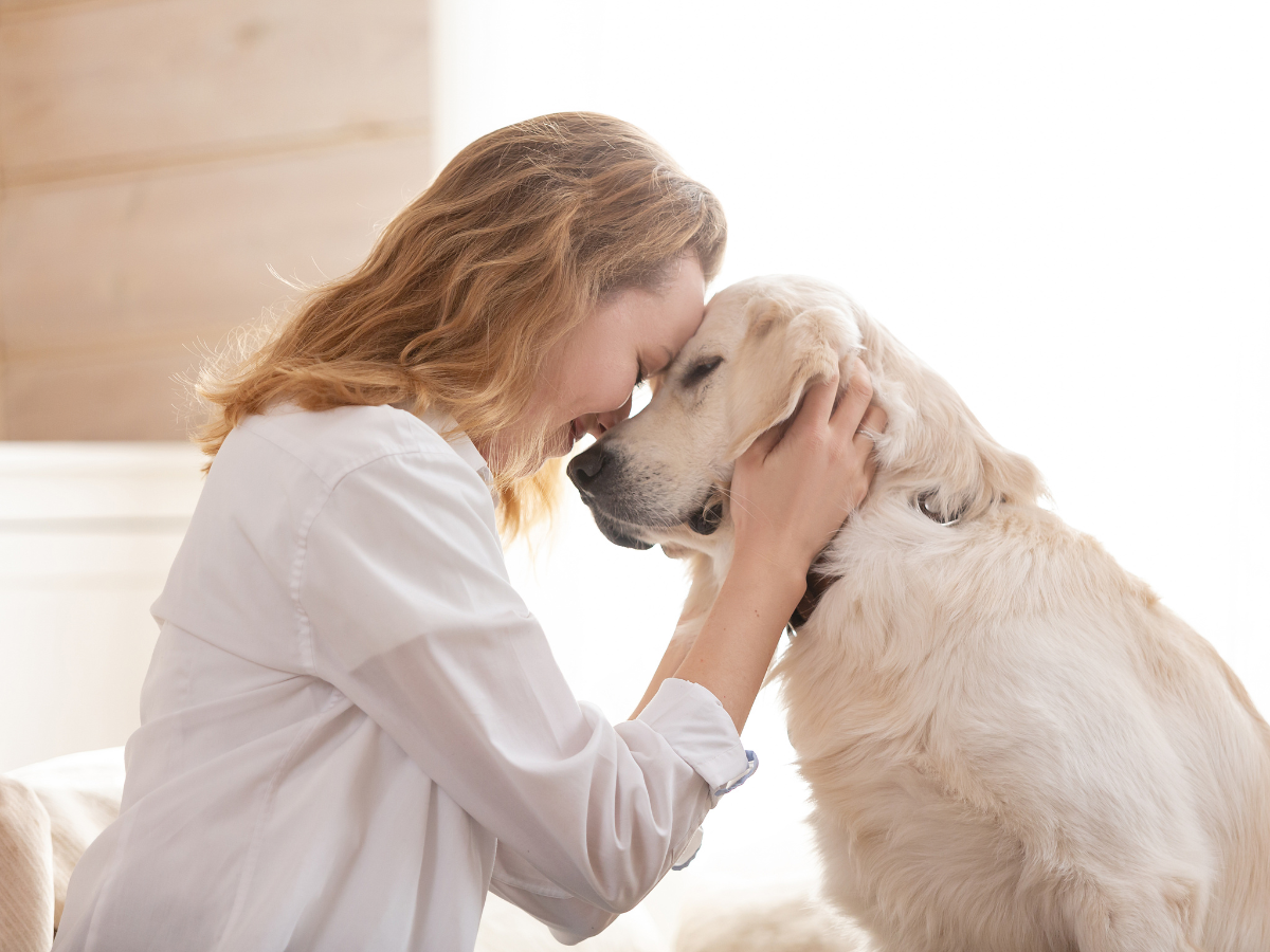 women and pet looking at each other